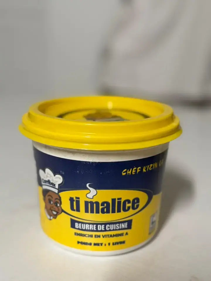 Container of Ti Malice cooking fat with yellow lid on a white background